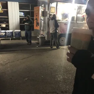 a woman holding a cup of coffee