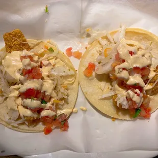Baja Style Tacos - breaded shrimp and fish with soft corn tortillas, pickled cabbage, pico de gallo, and baja sauce