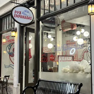 a bench in front of a store