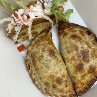 Chicken, beef empanadas and carnitas taco - 3 for $12