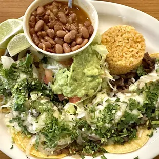 #10 Mariachi Plate, 4 mini tacos with Carne Asada, grilled onions, cheese, guacamole, rice &amp; charro beans.