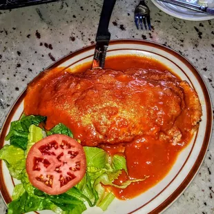 Melanzana alla Parmiggiana: Baked eggplant in marinara sauce with mozzarella cheese. $14