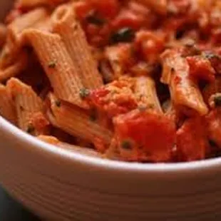 a bowl of pasta with tomato sauce