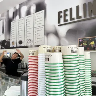 coffee cups stacked on a counter