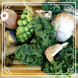a variety of vegetables in a wooden box