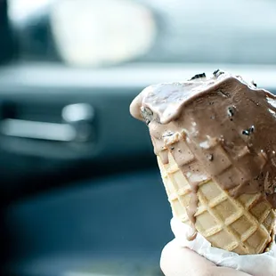 Half-eaten dark chocolate with oreos in a cone