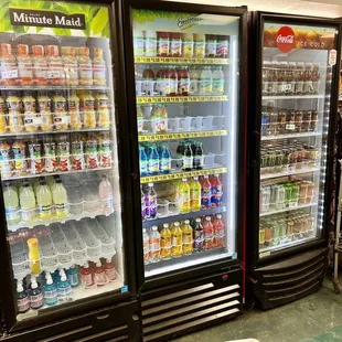 a grocery cart in front of a refrigerated refrigerator
