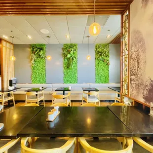 a dining area with tables and chairs