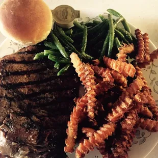 Ribeye with green beans, sweet potato fries and a roll and it came with the salad bar for $22 after tax