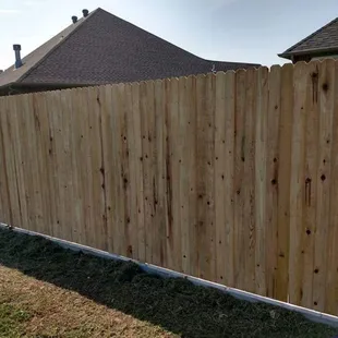 Cedar fence with stem wall