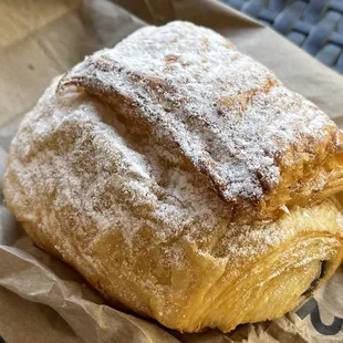 a pastry with powdered sugar on top