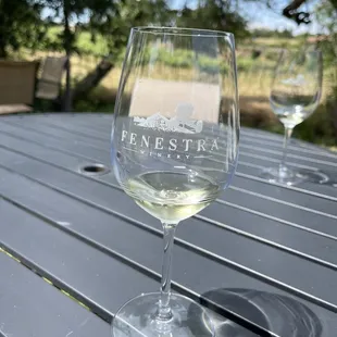 a glass of wine on a table