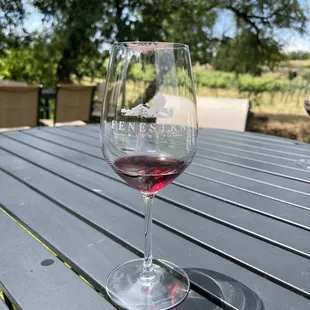 a glass of wine on a table