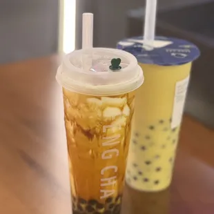 Creme brûlée dirty boba (front), mango au lait with boba (back)