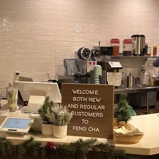 a kitchen counter with a welcome sign