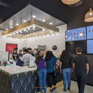 a group of people at a counter