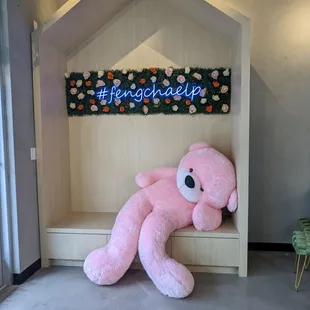 a pink teddy bear in a house