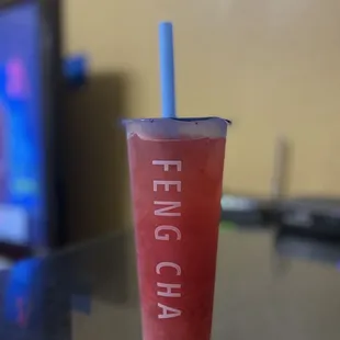 a cold beverage in a plastic cup