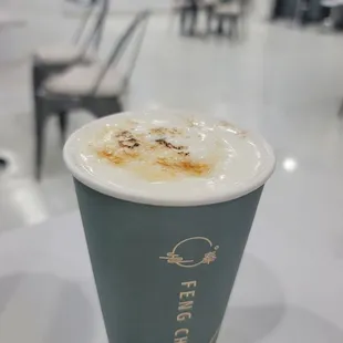 a cup of coffee on a table