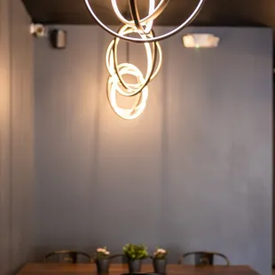 a dining room with a wooden table and chairs