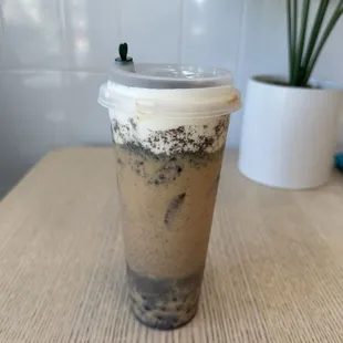 a cup of iced coffee on a table