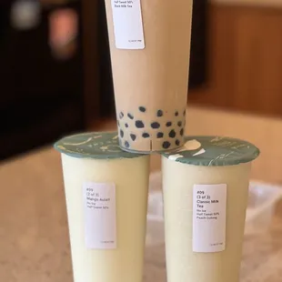 three cups of tea on a counter