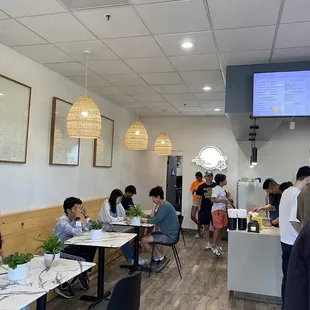 a group of people sitting at tables