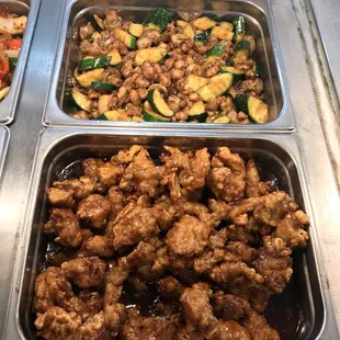 three trays of food in a restaurant