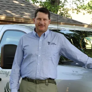 a man standing in front of a truck