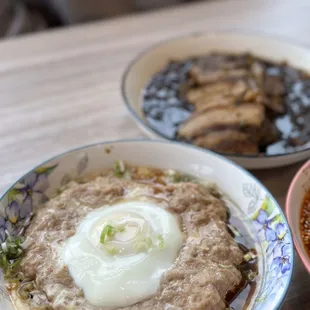 two bowls of food on a table