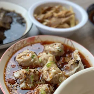 a bowl of soup and a bowl of dumplings