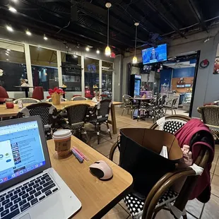 a laptop on a wooden table
