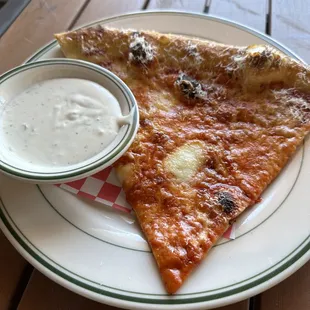 Cheese pizza slice with ranch