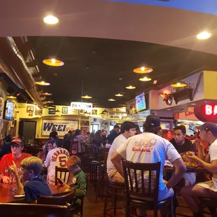 a large group of people sitting at tables