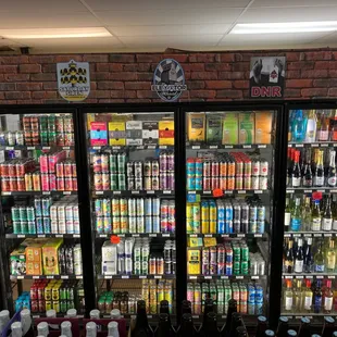 Support local brewers, cold beers in cooler at Fenwick Liquor