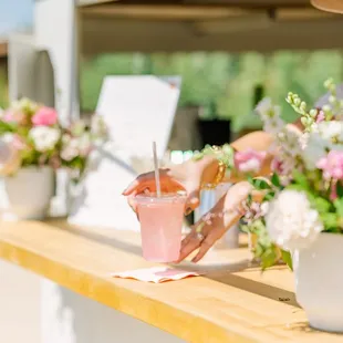 a woman pouring a drink