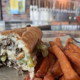 Philly cheesesteak and potato fries