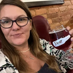 a woman holding a glass of wine