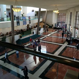 people walking through the lobby