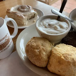 Country breakfast and a cinnamon roll.