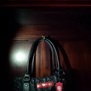 At the bar, there are hooks to hang your purse!