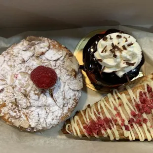 Almond Ricotta Cake, Red Velvet Cheesecake, and white Chocolate chip scone.