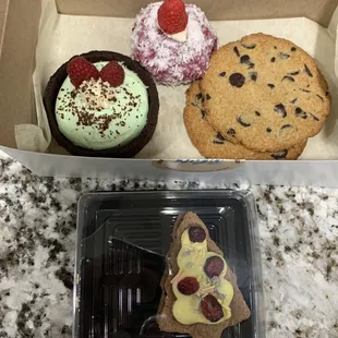 Top: Pistachio Mousse in a brownie cup, Raspberry cake with coconut flakes, Chocolate Chip Cookies and Ginger bread cookie/cake.