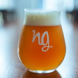 a glass of beer on a table