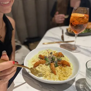 Shrimp and grits with an Aperol Spritz