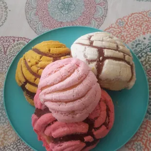 three desserts on a blue plate
