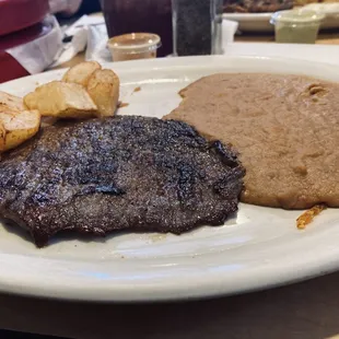 Steak, beans, and potatoes