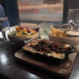 Escondidinho De Frango(Brazilian-style chicken shepards pie, mashed potatoes with melted mozzerella) with Yuca Fried and side salad.