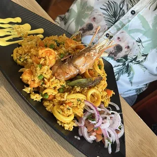 a plate of food with shrimp and rice