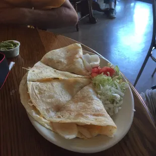 a plate of quesadillas on a table